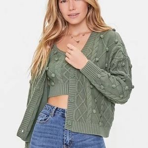 Cable knit pom pom ball sweater